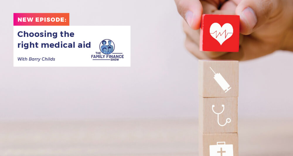 Four small wooden blocks being placed in a tower. The bottom block has an image of a first-aid kit, the second a stethoscope, the third a syringe, and the top block (coloured red) is a heart with pulse.