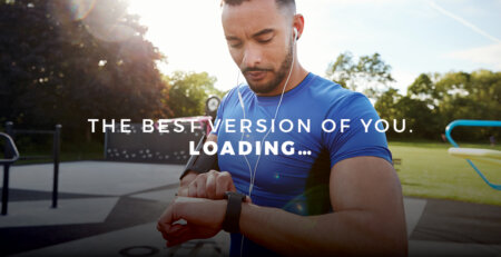 man in running gear looking at a wearable device on his wrist with the words, "THE BEST VERSION OF YOU | LOADING..."